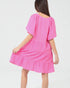 Pink dress worn by a person on a white background