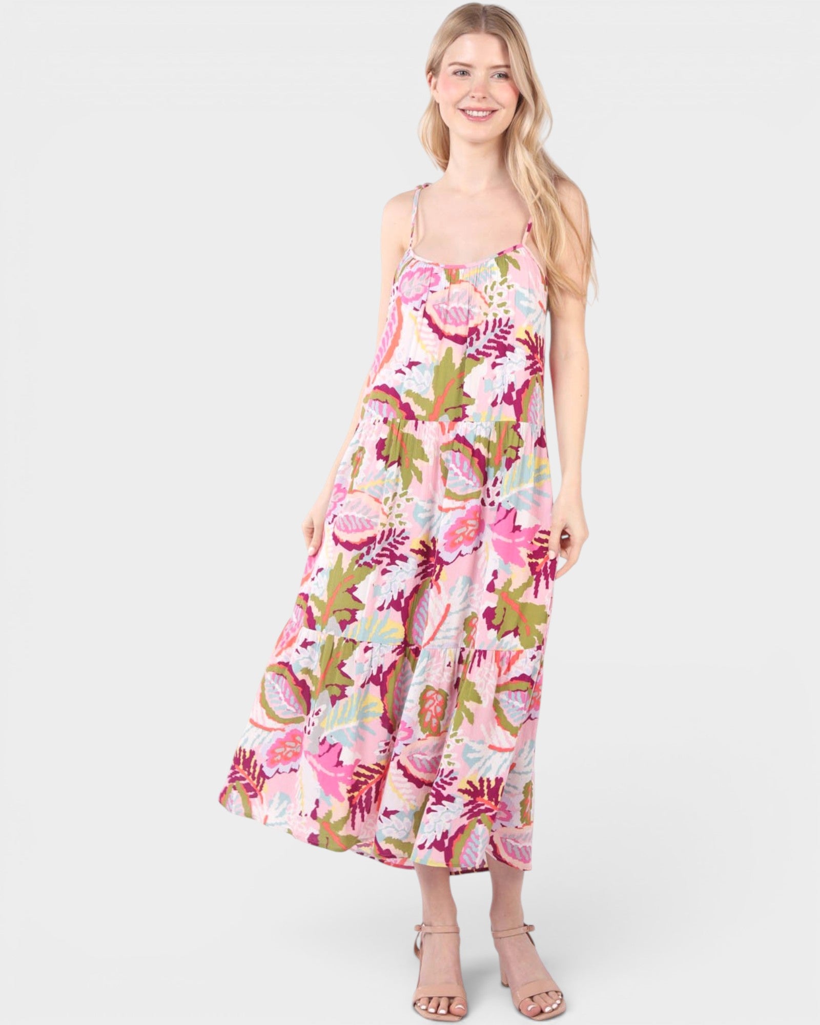 Woman wearing a floral dress on a white background
