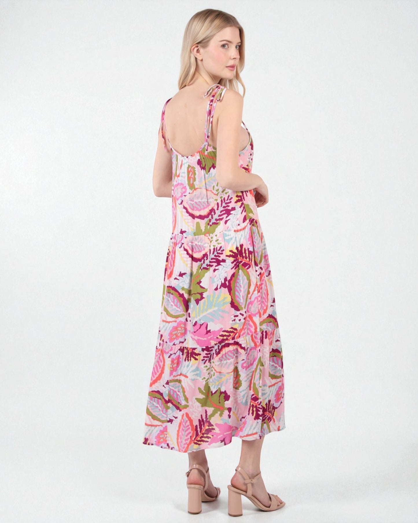 Woman wearing a floral dress on a white background