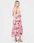 Woman wearing a pink floral dress on a white background