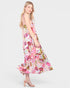 Woman wearing a floral dress on a white background