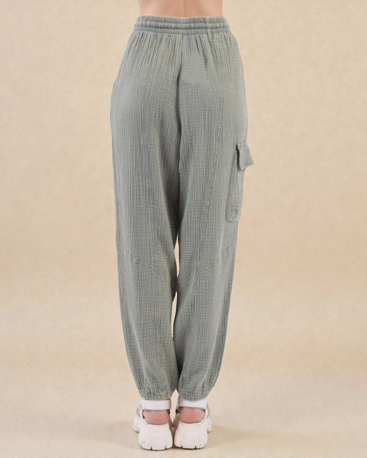 Gray checkered cargo pants on a beige background