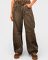 Brown wide-leg pants worn by a person on a light gray background