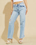 Light blue jeans worn by a person on a beige background
