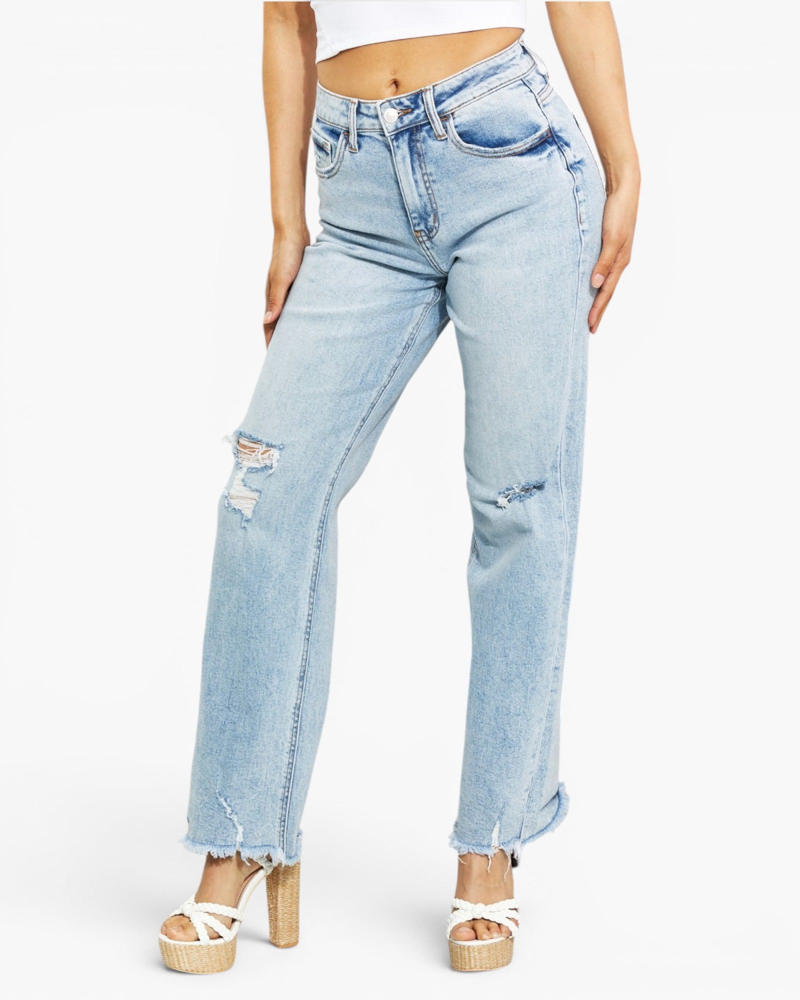 Light wash blue distressed jeans with a straight-leg fit, featuring ripped details on the thighs and cuffed hems, modeled with platform sandals against a plain white background.