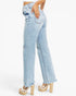 Light wash blue denim jeans with a straight-leg fit, featuring distressed details on the thighs and a raw frayed hem, modeled with platform sandals against a white background.