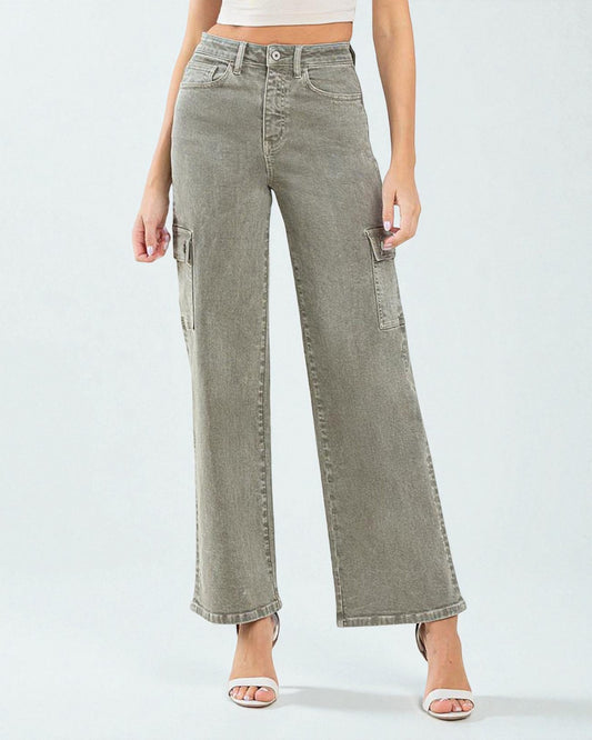 Person wearing light green wide-leg jeans on a white background