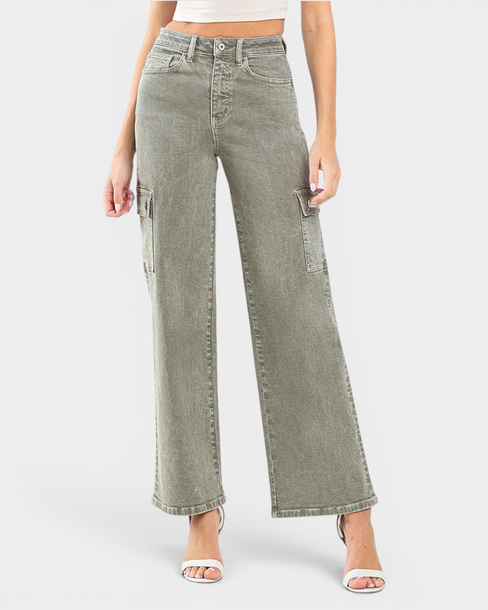 Person wearing light green wide-leg jeans on a white background