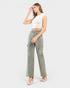 Woman wearing a white crop top and gray cargo pants on a white background