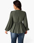 A woman shown from the back wearing an olive green long-sleeve peplum top with gathered detailing at the waist, paired with blue jeans, against a plain white background.
