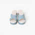 A pair of women's platform slide sandals with light blue crisscross straps and white platform soles, shown from a top-down view on a white background.