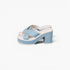 A pair of women's platform sandals in light blue and white, featuring crisscrossing straps and a chunky block heel, shown against a plain white background.