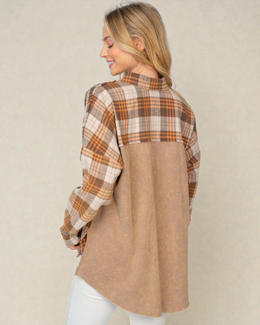 Woman wearing a plaid shirt with a beige background