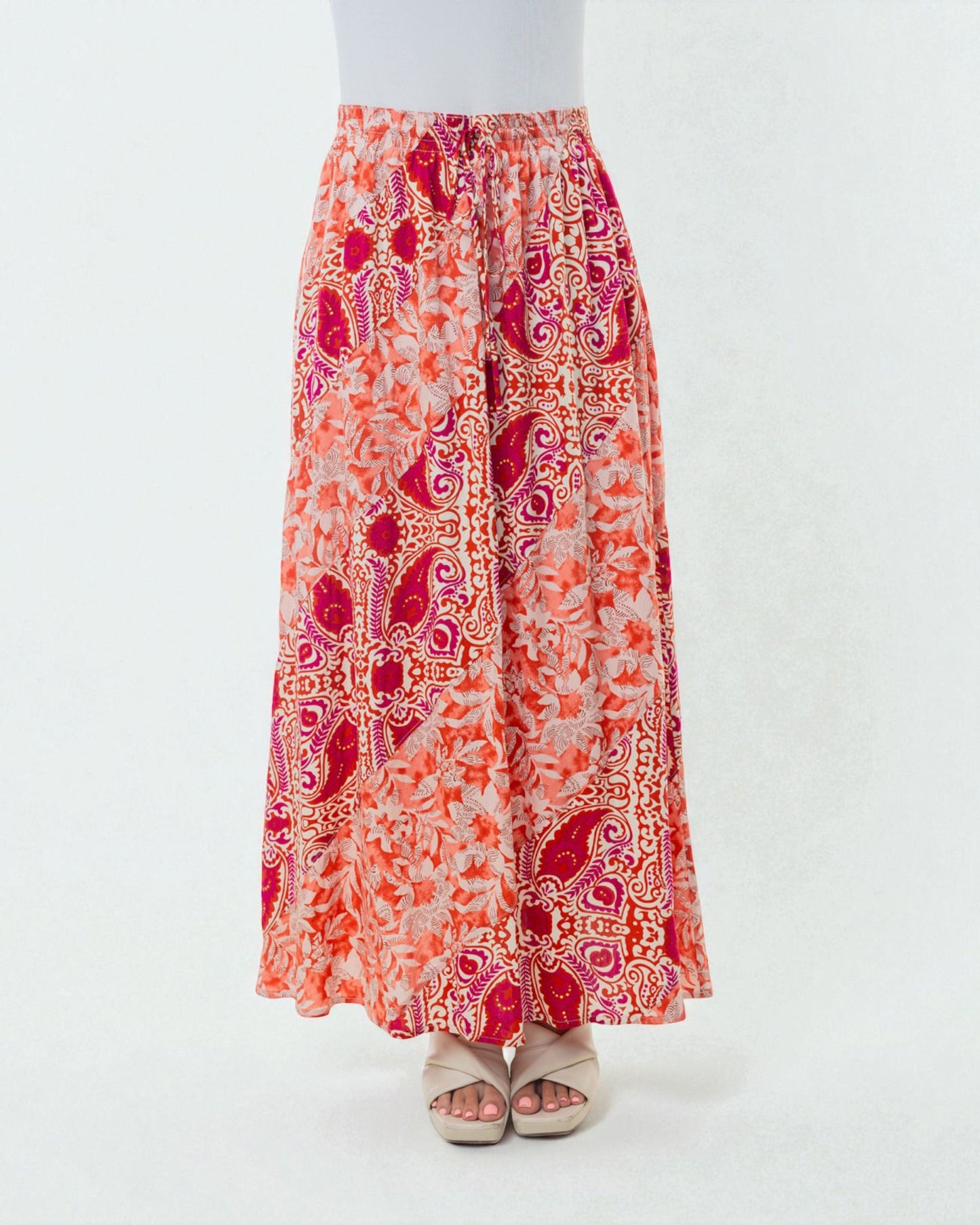 Long patterned skirt with red and orange design on a white background