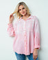 Woman wearing a pink checkered shirt against a white background