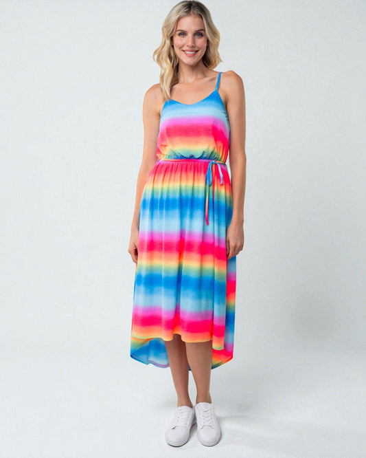 Woman wearing a colorful striped dress on a white background