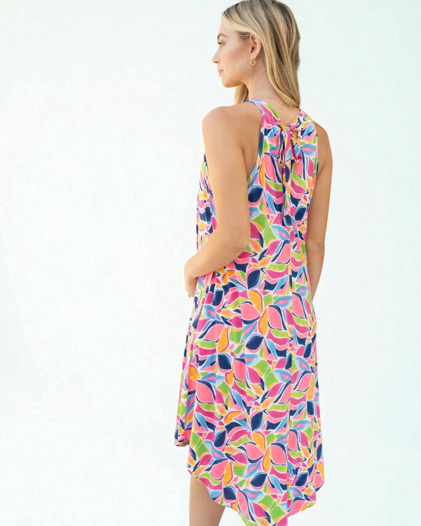 Woman wearing a colorful dress with a white background