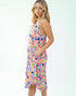Woman wearing a colorful dress with a white background