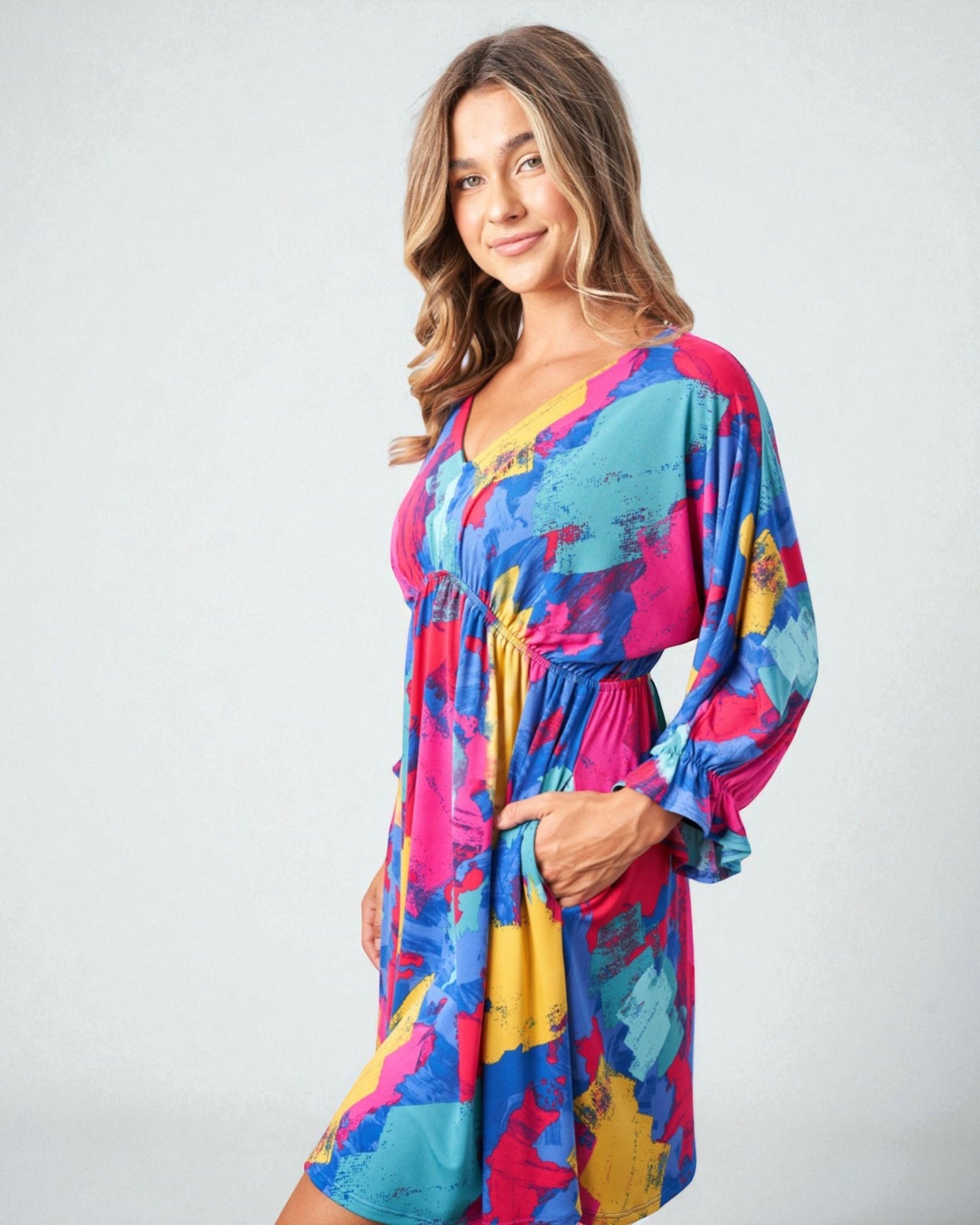 Woman wearing a colorful dress on a white background