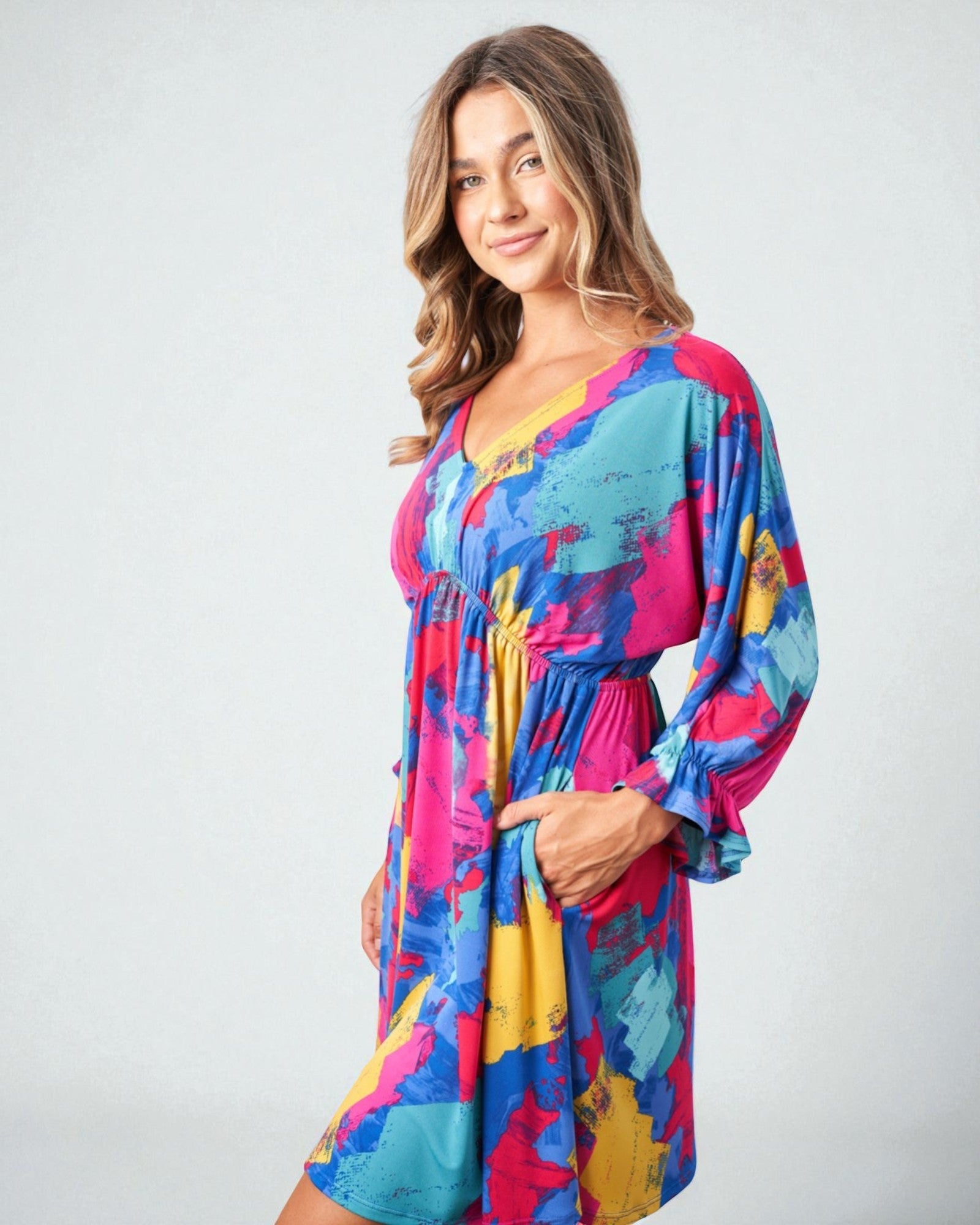 Woman wearing a colorful dress on a white background