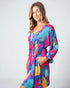 Woman wearing a colorful dress on a white background