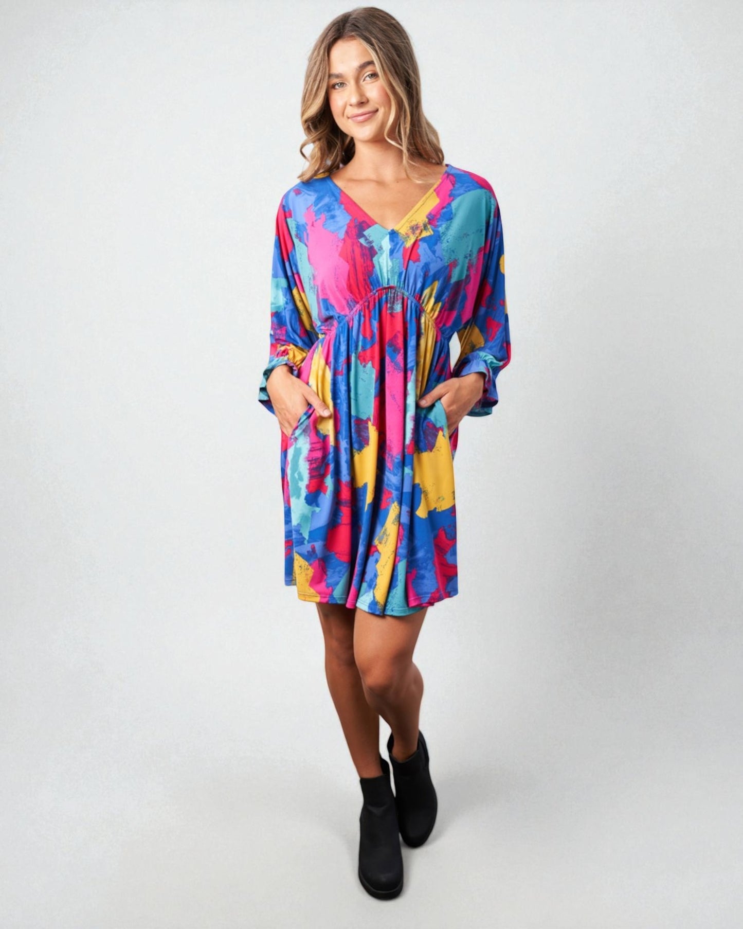 Woman wearing a colorful dress on a white background