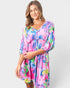Woman wearing a colorful dress with a white background