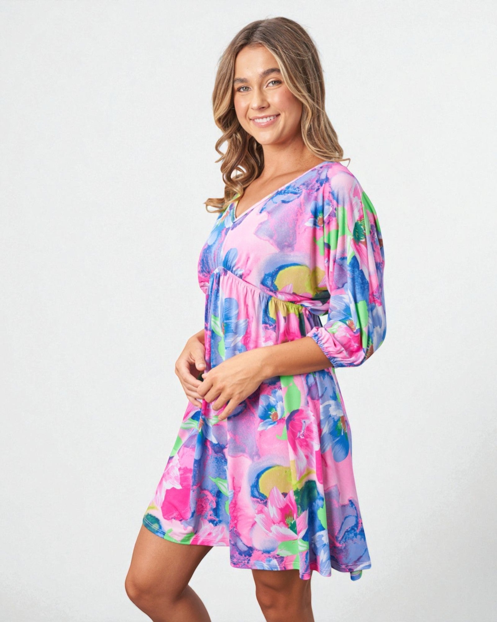 Woman wearing a colorful dress with a white background