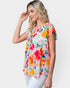 Blusa tejida con flores y mangas cortas en blanco y multicolor