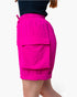 Bright pink cargo shorts with a drawstring waist and large front flap pocket, shown on a model against a plain light background.