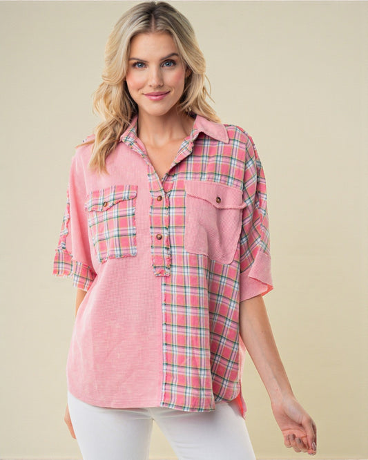 Woman wearing a pink plaid shirt against a beige background