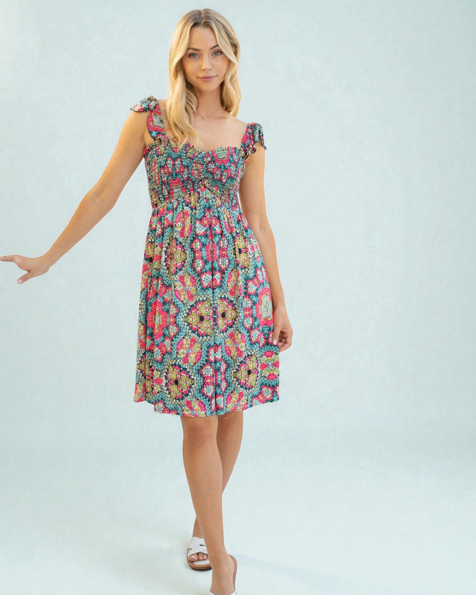 Woman wearing a floral dress on a light blue background