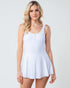 Woman wearing a white sleeveless dress against a plain background