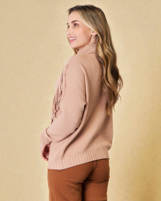 Woman wearing a pink sweater against a beige background