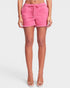 Person wearing pink shorts on a white background