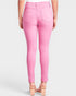 Pink jeans worn by a person on a white background
