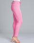 Pink jeans worn by a person on a gray background