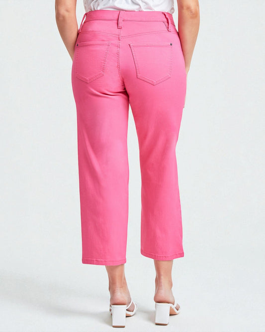 Person wearing bright pink pants on a white background