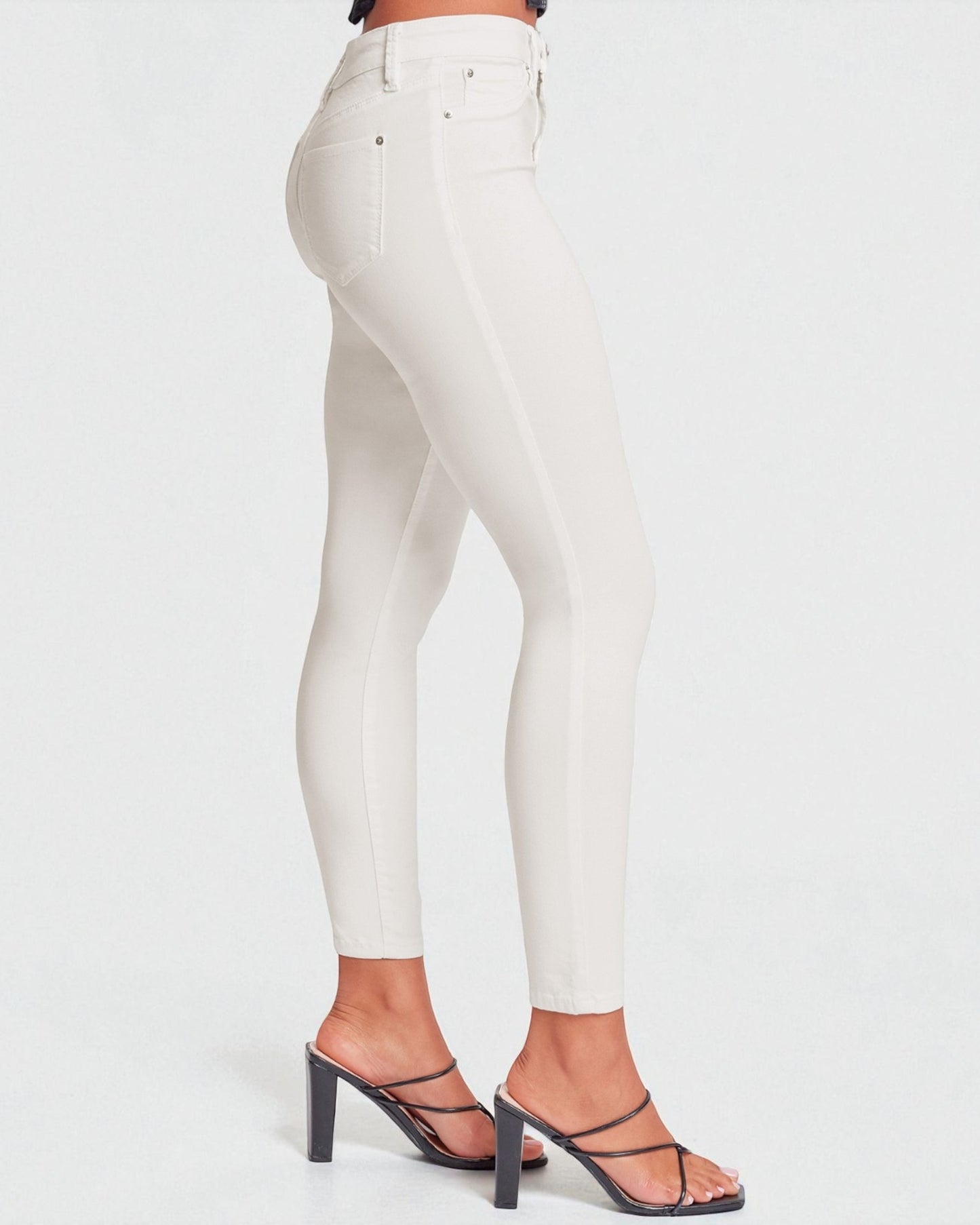 White leggings worn by a person on a white background