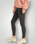 Person wearing black leggings and a pink sweatshirt on a light gray background