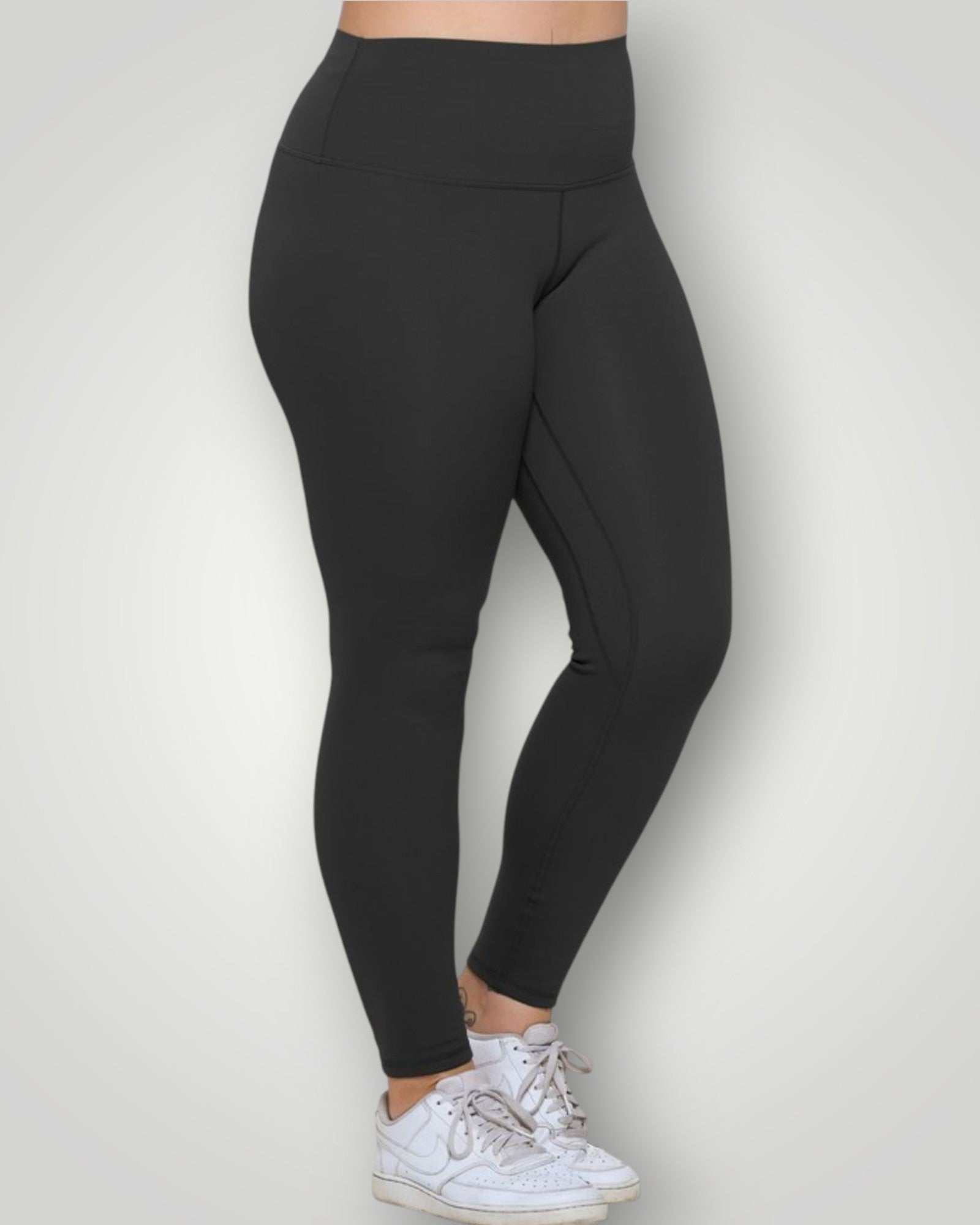 Black leggings worn by a person on a white background