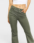 Person wearing olive green pants on a light gray background
