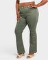 Person wearing olive green pants on a white background