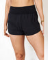 Black shorts worn by a person on a white background