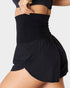 Black skirt worn by a person on a white background