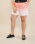 Person wearing a colorful ombre shorts with a plain background