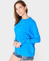 Woman wearing a blue sweater on a white background