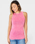 Woman wearing a pink ribbed tank top against a white background