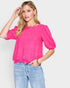 Jersey de media manga con cuello redondo en fucsia
