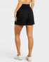 Black shorts worn by a person on a white background